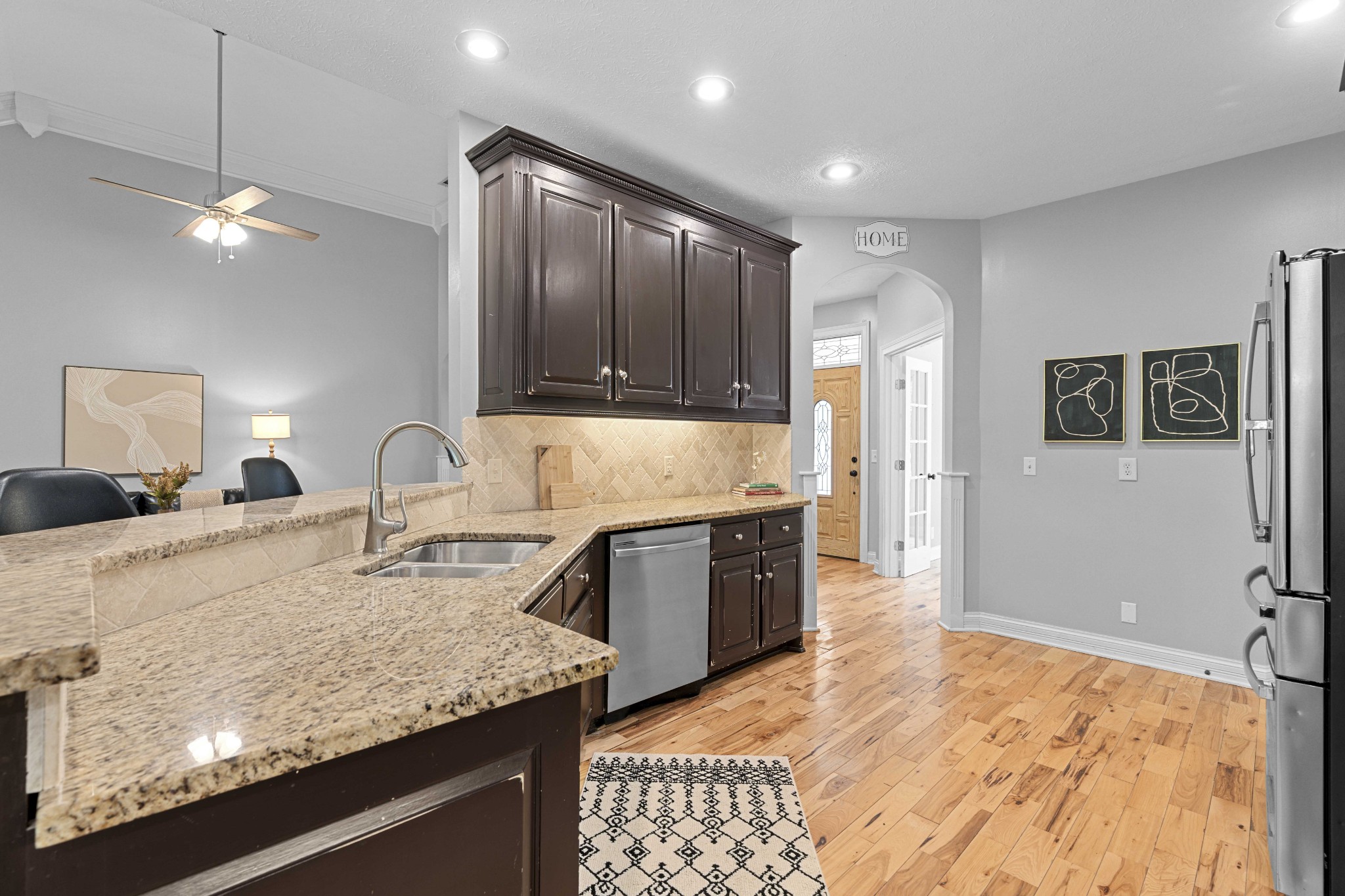 7339 Chowning Road Springfield, TN 37172 - Photo 19 of 57 a large kitchen with kitchen island granite countertop a sink refrigerator and cabinets