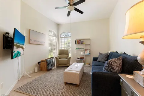a bathroom with a sink a toilet and a large mirror