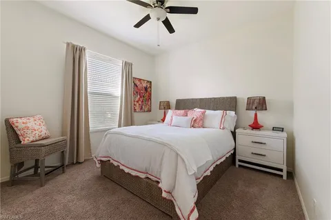 a bed room with a bed and a window