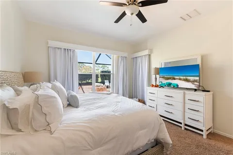 a view of a dining room with furniture wooden floor and a chandelier