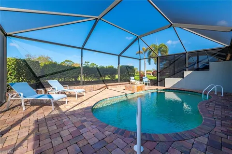 a view of a patio with couches table and chairs