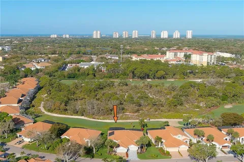 an aerial view of a house with outdoor space lake view and mountain view