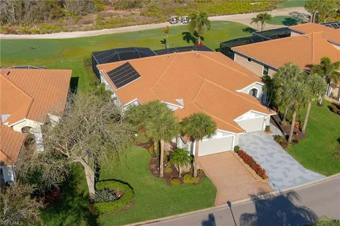 an aerial view of houses with yard