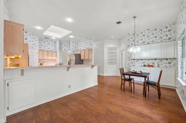 a view of a kitchen and dining room