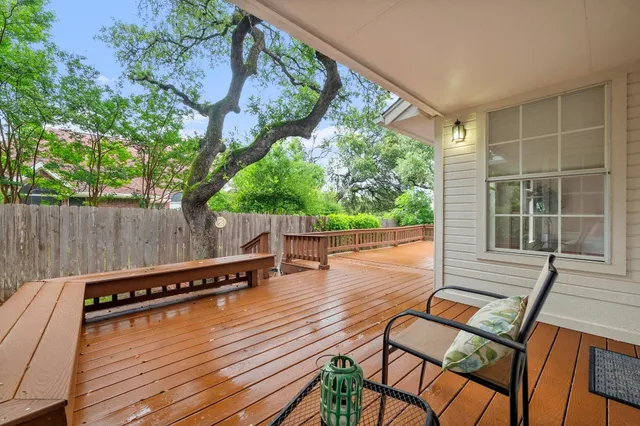 a view of a chairs and table on the wooden deck