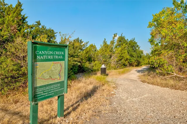 a view of a pathway with a park
