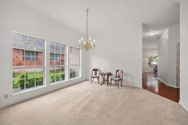 a view of a dining room with furniture window and outside view
