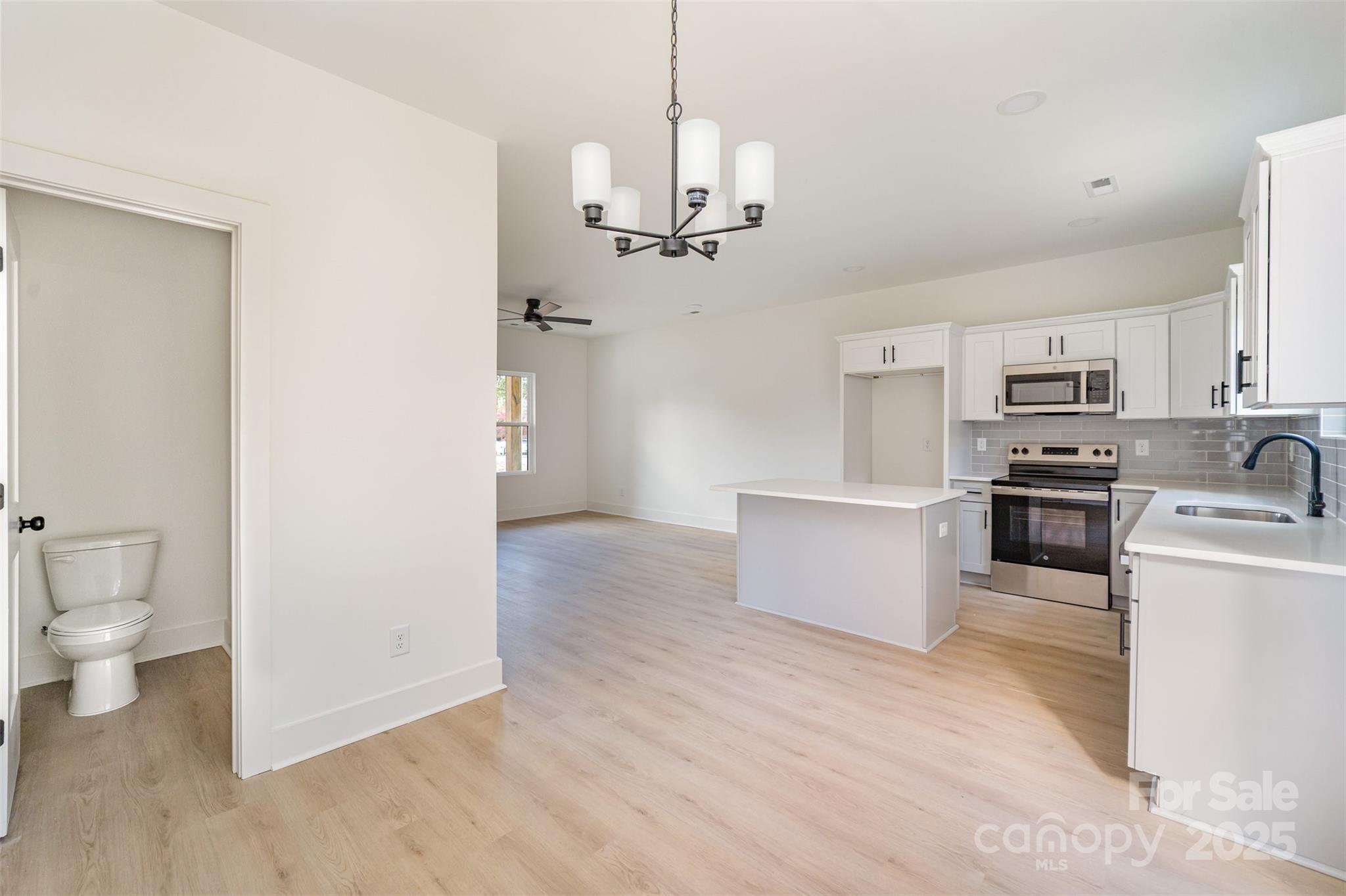 604 6th St Court Northwest Conover, NC 28613 - Photo 11 of 31 a view of a kitchen with stove and refrigerator