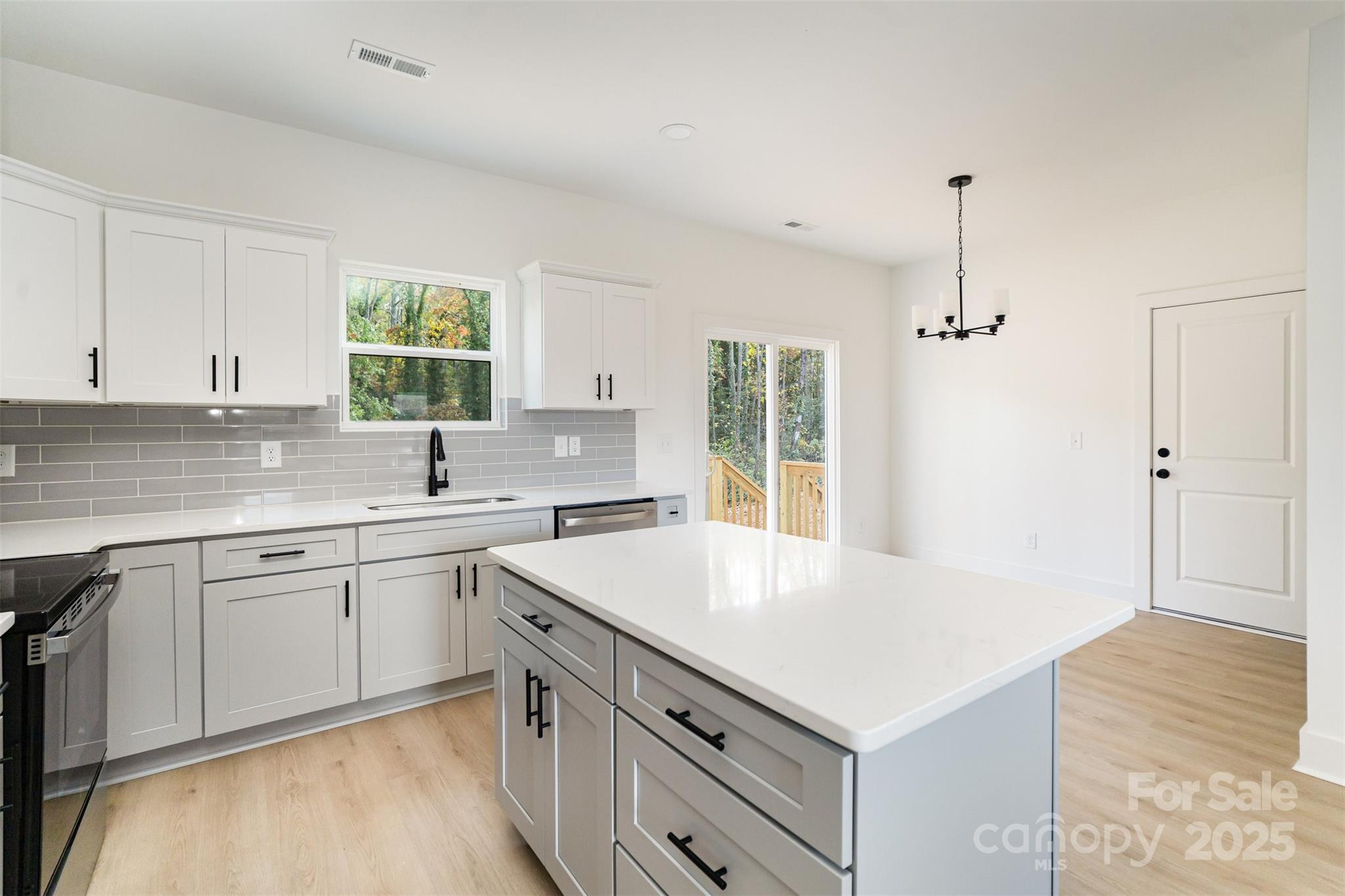 604 6th St Court Northwest Conover, NC 28613 - Photo 13 of 31 a kitchen with a sink stove and cabinets