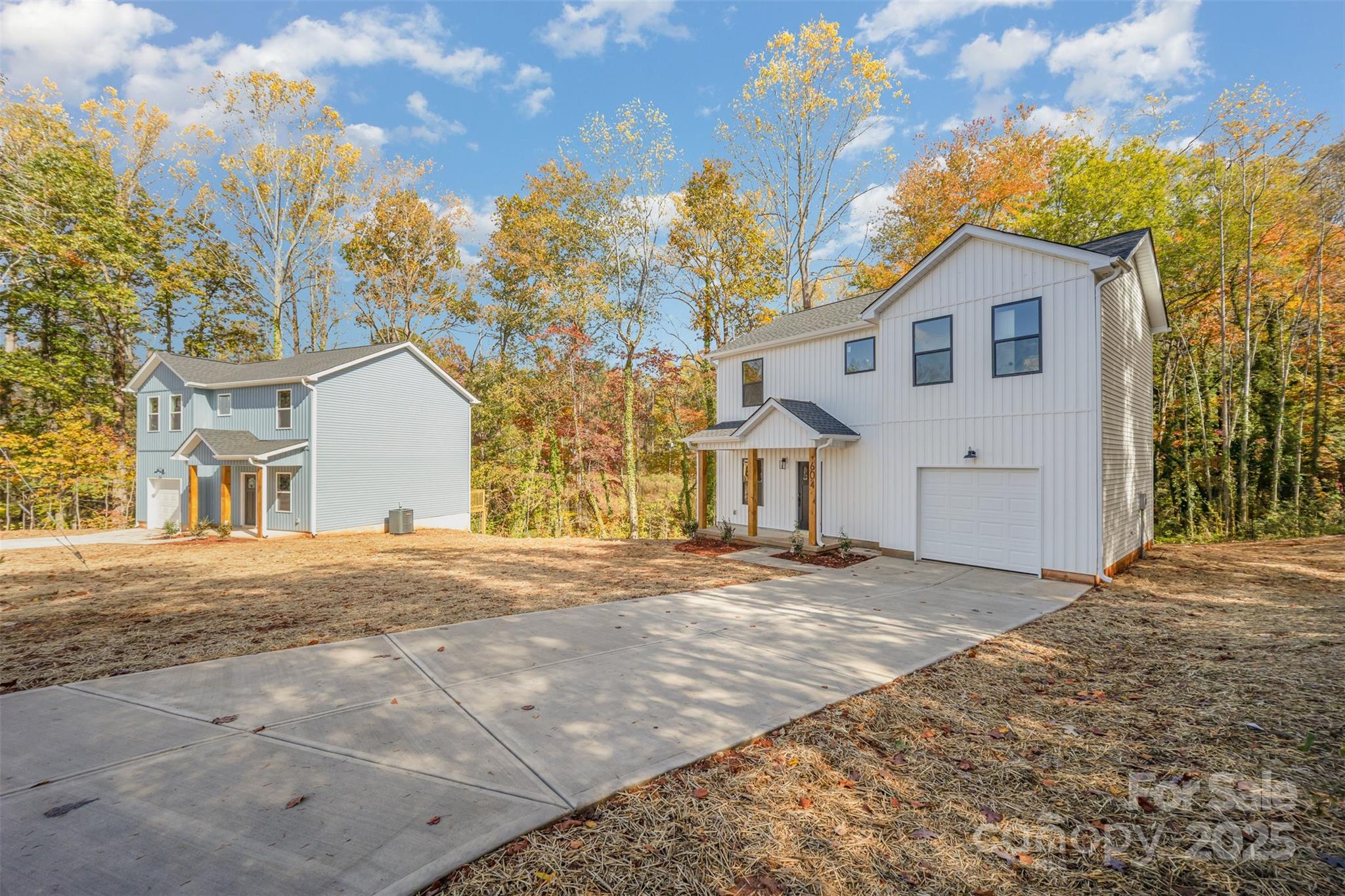 604 6th St Court Northwest Conover, NC 28613 - Photo 2 of 31 a front view of a house with a yard and garage