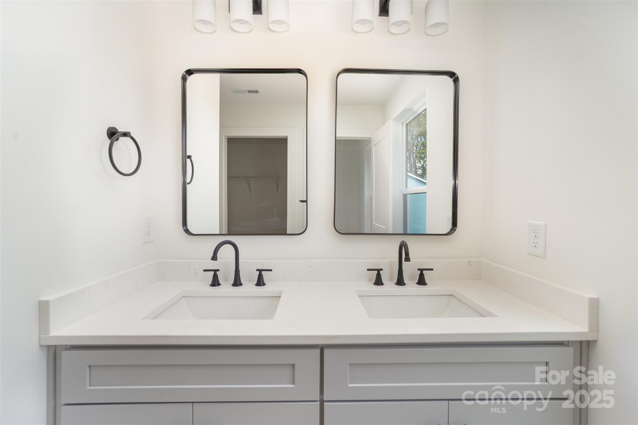 604 6th St Court Northwest Conover, NC 28613 - Photo 21 of 31 a bathroom with double vanity sinks and a mirror
