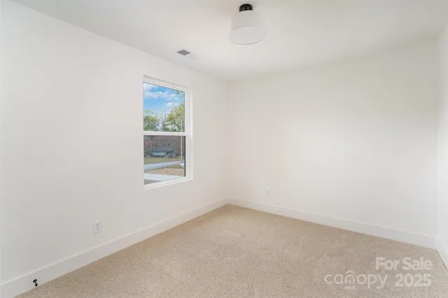 a view of wooden balcony with trees