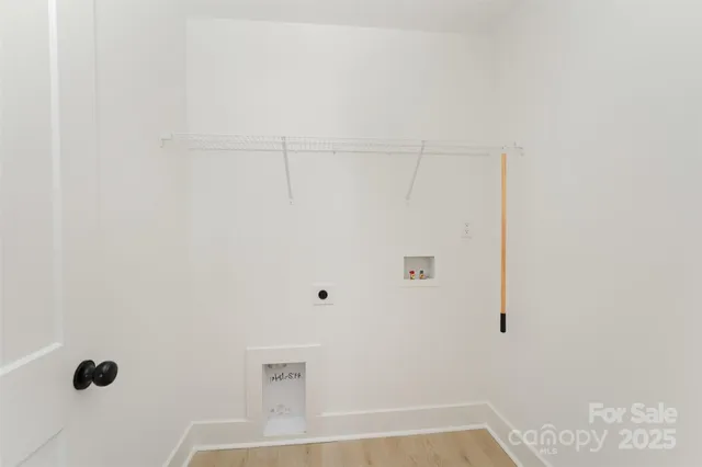 a view of a sink with a door and a yard