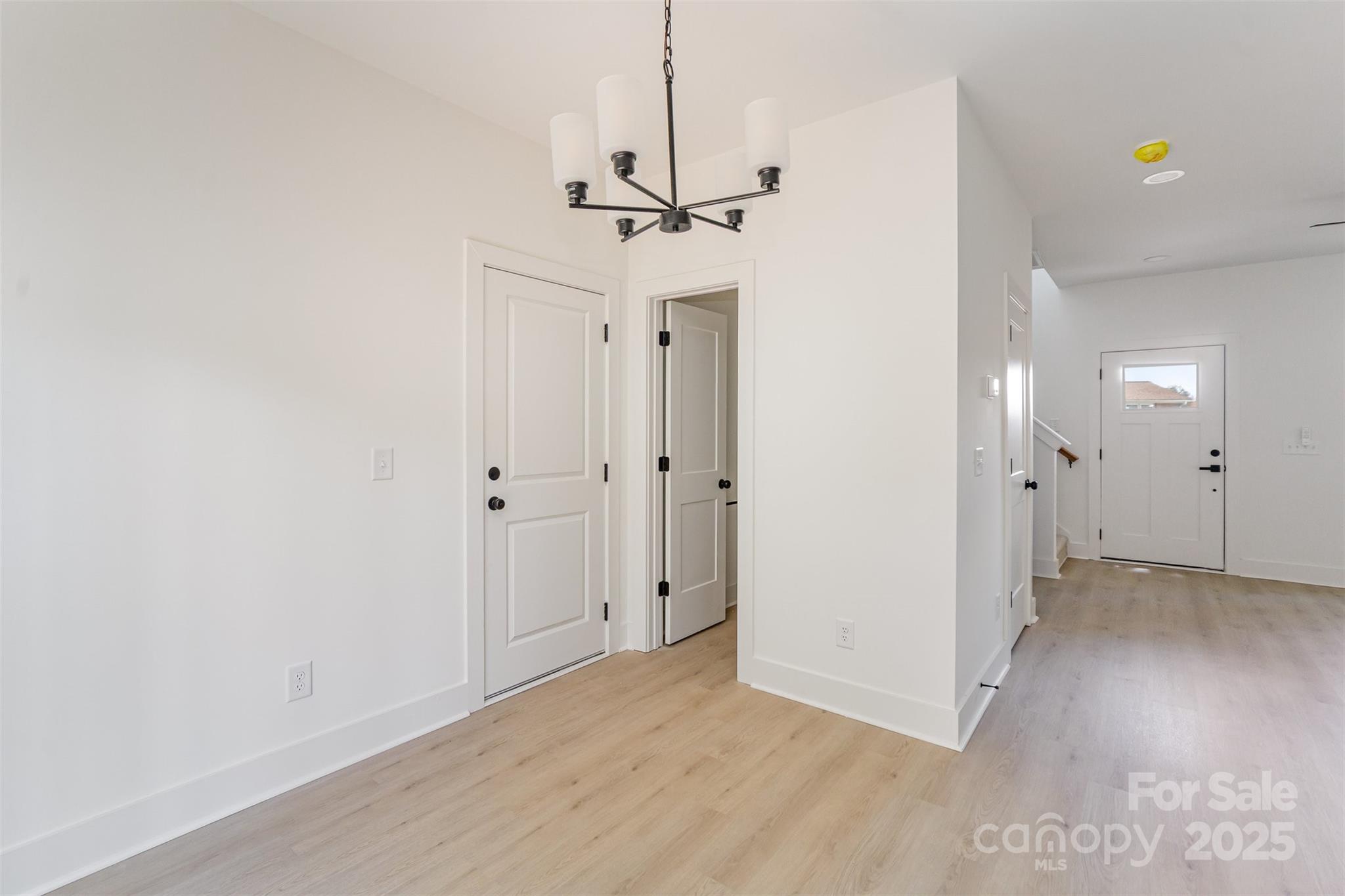 604 6th St Court Northwest Conover, NC 28613 - Photo 8 of 31 an empty room with chandelier fan