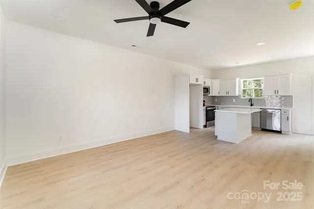 a view of a kitchen with a sink cabinets and window