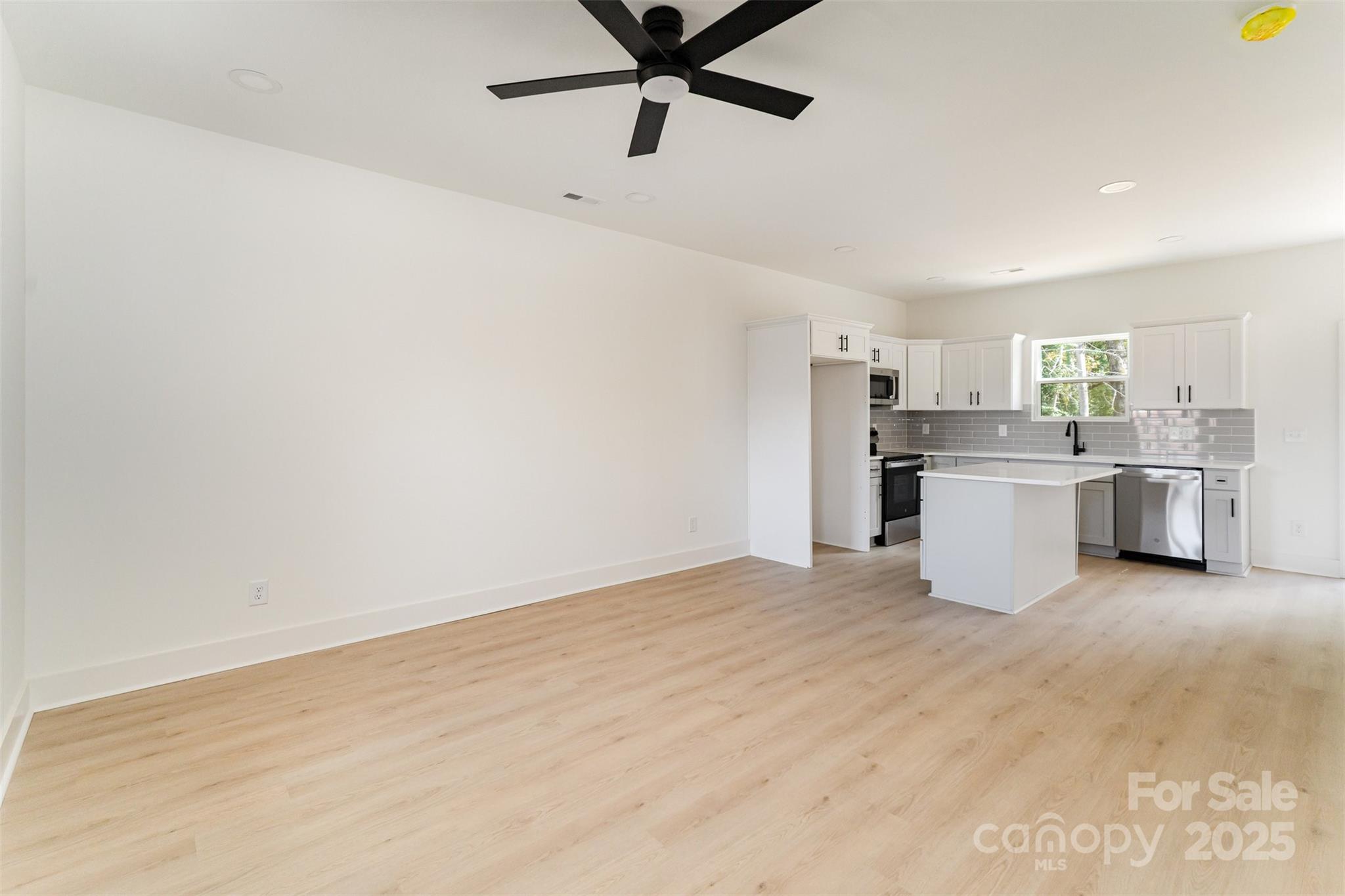 604 6th St Court Northwest Conover, NC 28613 - Photo 9 of 31 a view of a kitchen with a sink cabinets and window