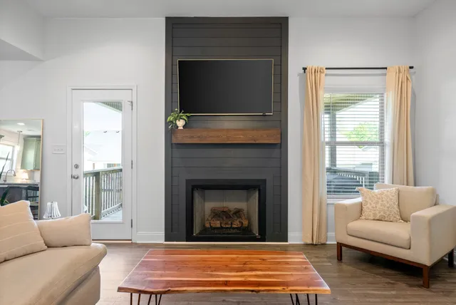 a living room with furniture and a fireplace