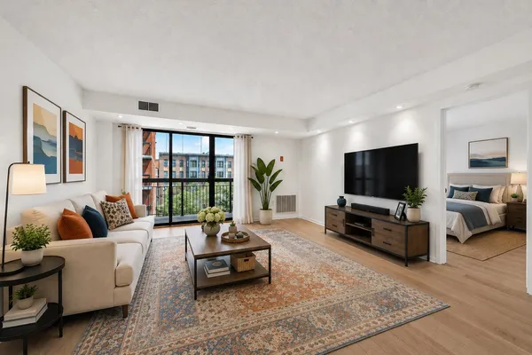 a living room with furniture and a flat screen tv