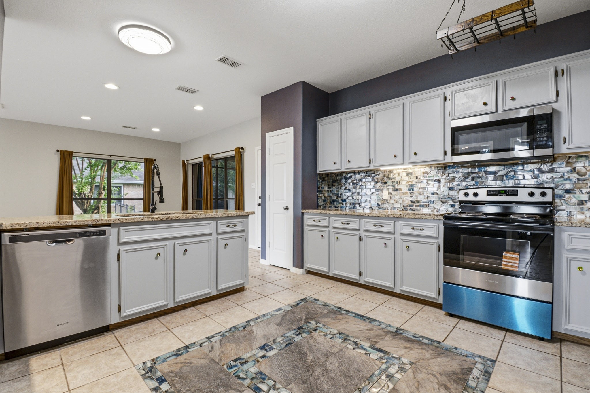 12557 Marina Loop Willis, TX 77318 - Photo 10 of 36 Kitchen open to dining room