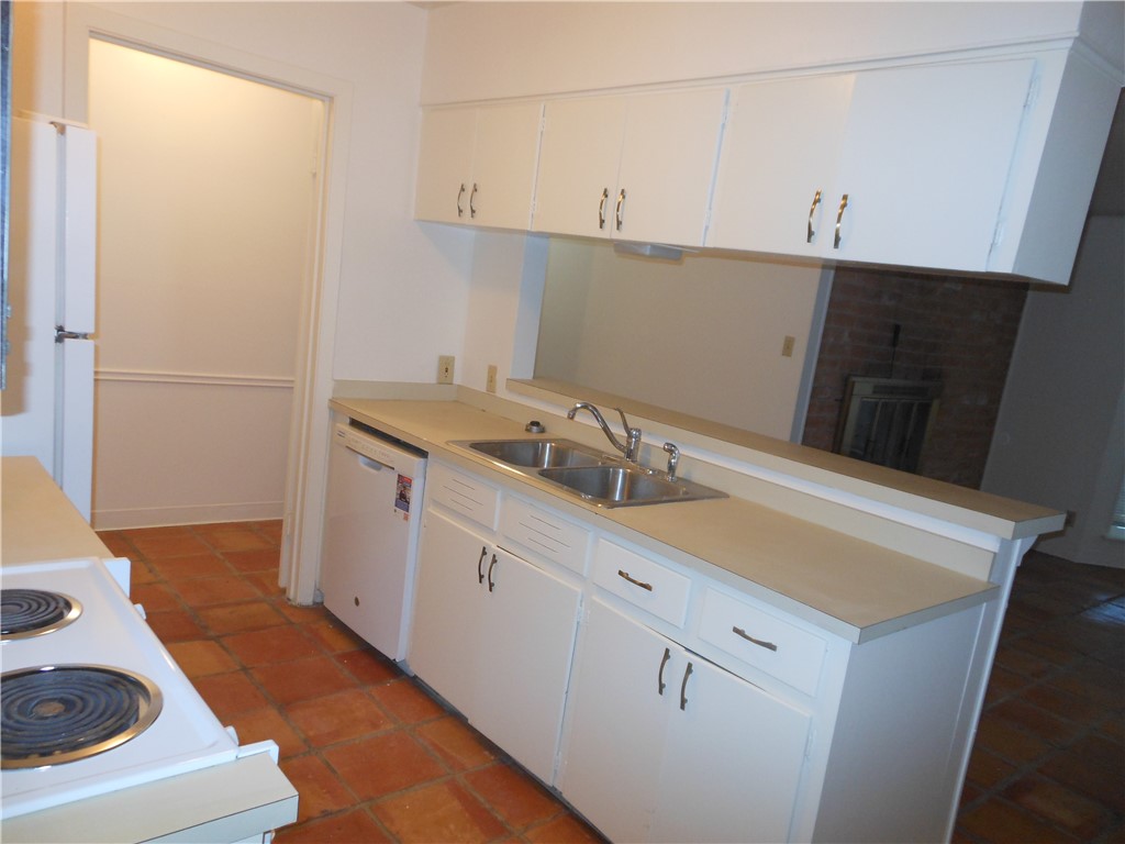 Undisclosed Address Austin, TX 78704 - Photo 4 of 16 a kitchen with a sink and a stove top oven