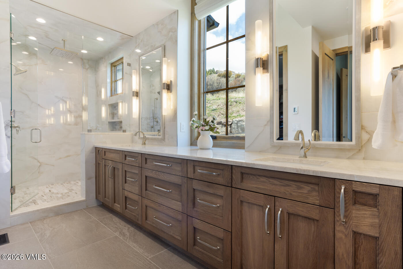 5205 Long Sun Lane Avon, CO 81620 - Photo 11 of 35 a bathroom with double vanity sinks and a shower