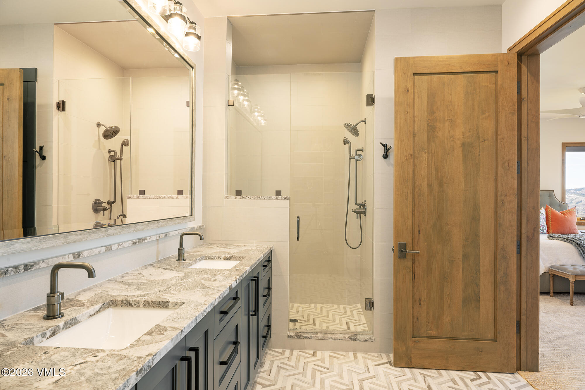 5205 Long Sun Lane Avon, CO 81620 - Photo 27 of 35 a bathroom with a granite countertop shower sink and mirror
