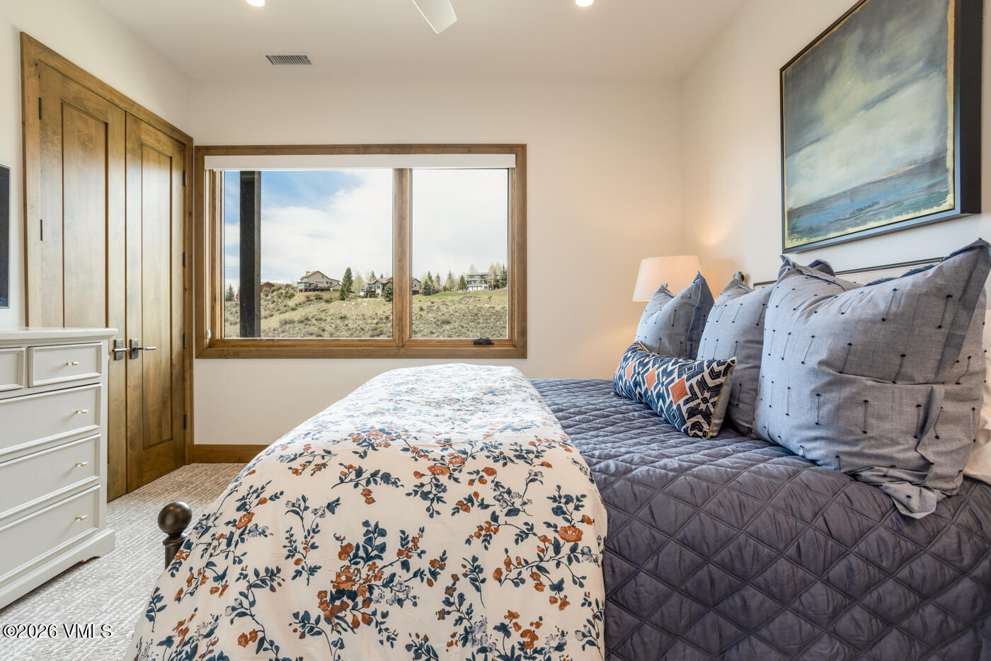 5205 Long Sun Lane Avon, CO 81620 - Photo 30 of 35 a bedroom with a large bed and a window