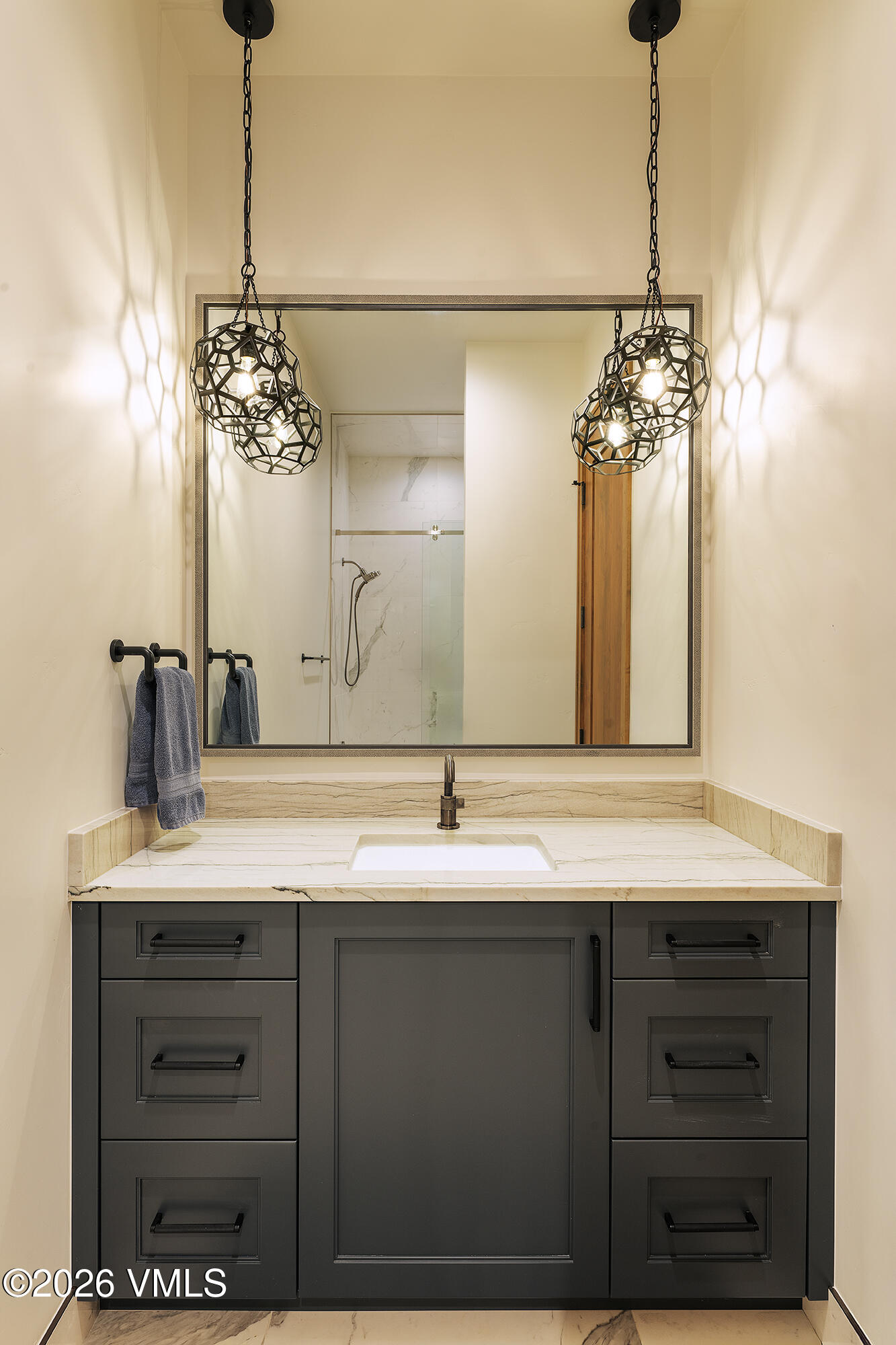 5205 Long Sun Lane Avon, CO 81620 - Photo 32 of 35 a bathroom with a sink and a mirror