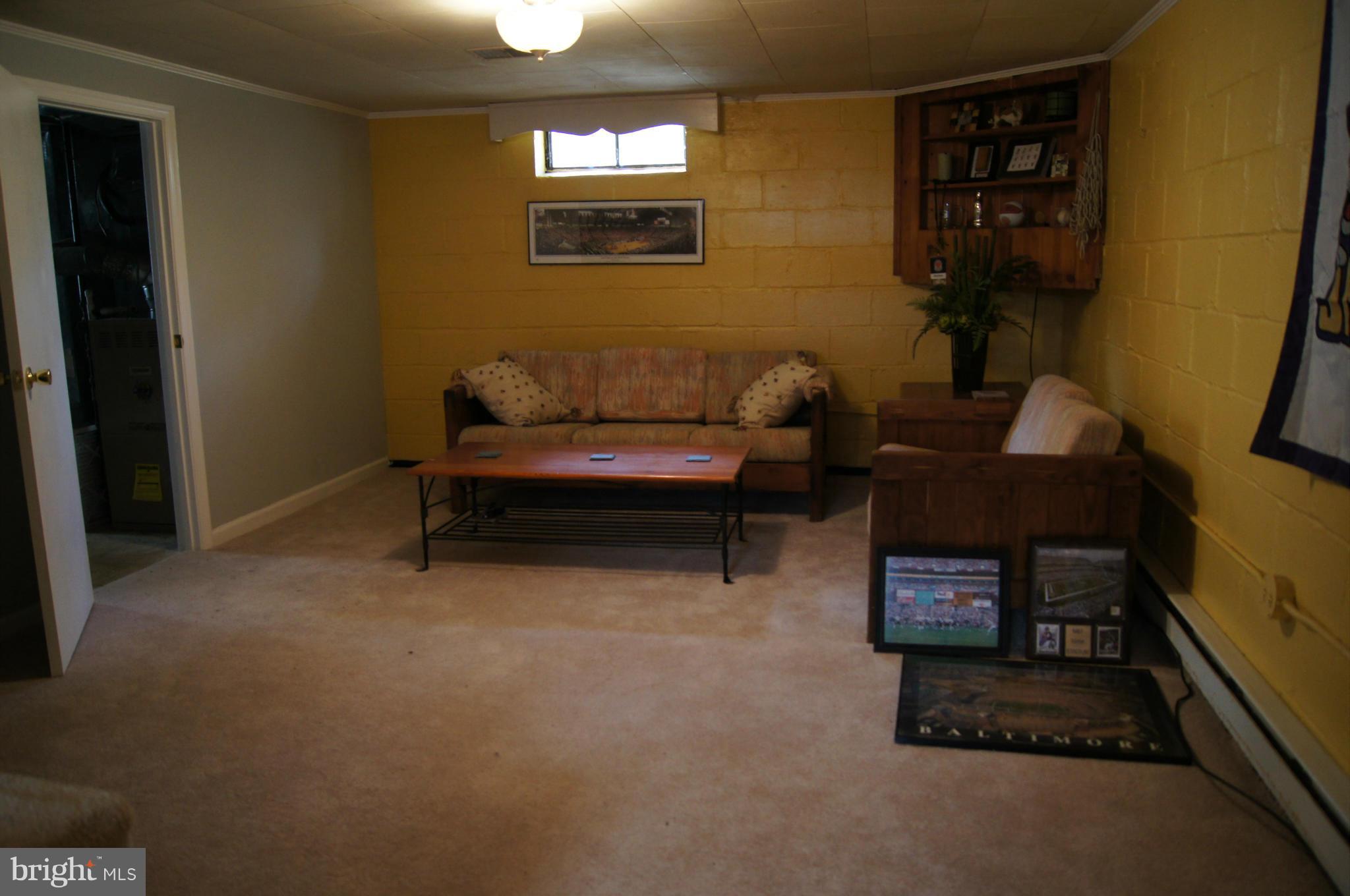 6607 Parkway Road Baltimore, MD 21239 - Photo 26 of 30 Rec room in lower level. Waterproofed.