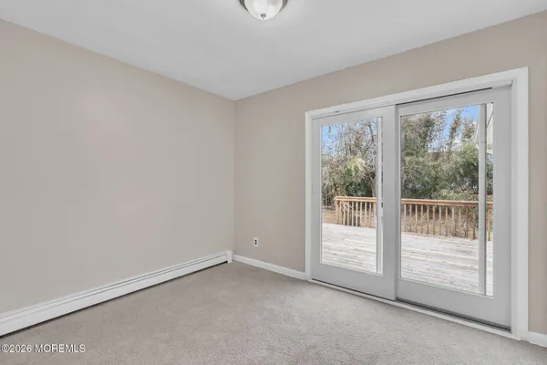 a view of empty room with floor to ceiling window