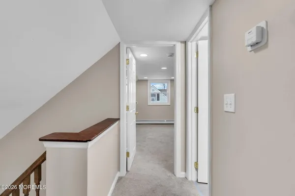 a view of a hallway with closet and hallway