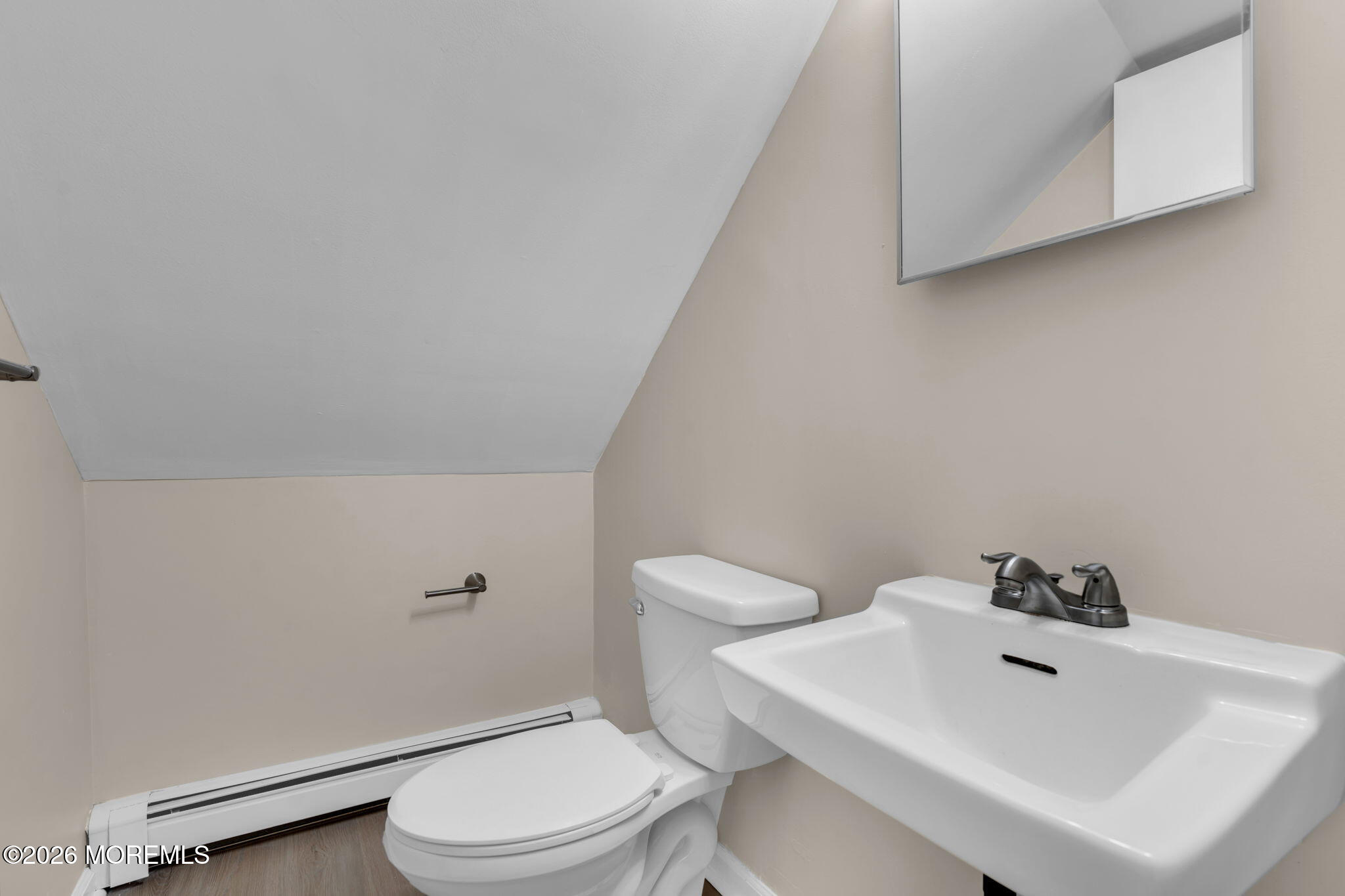 121 Harding Drive Brick, NJ 08724 - Photo 29 of 37 a white toilet sitting next to a bathroom sink