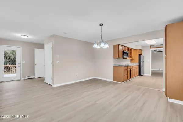 a view of a kitchen with a sink cabinets and wooden floor