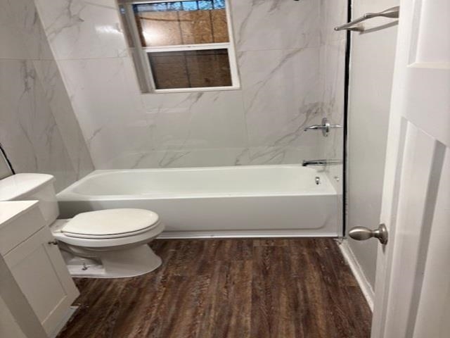 3268 Powell Avenue Memphis, TN 38112 - Photo 3 of 5 Full bathroom with vanity, dark wood-style floors, and shower / washtub combination