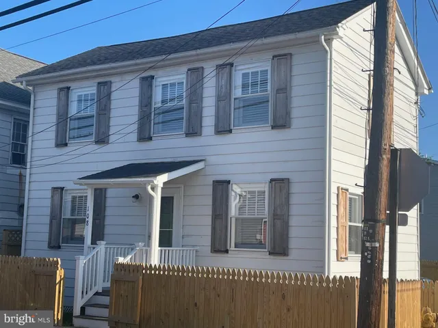a front view of a house with a porch