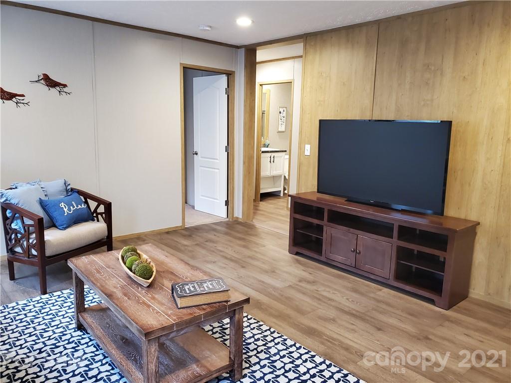531 Stony Point School Road Stony Point, NC 28678 - Photo 23 of 47 a living room with furniture and a flat screen tv