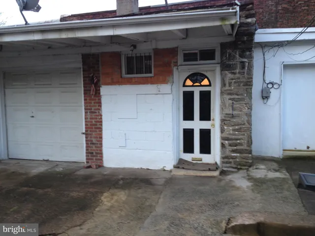 a view of a wooden door of the house