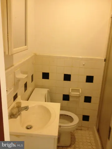 a bathroom with a sink and toilet