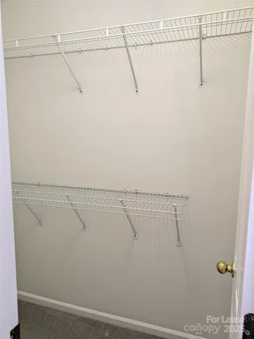 a view of a livingroom with a fireplace and wooden floor