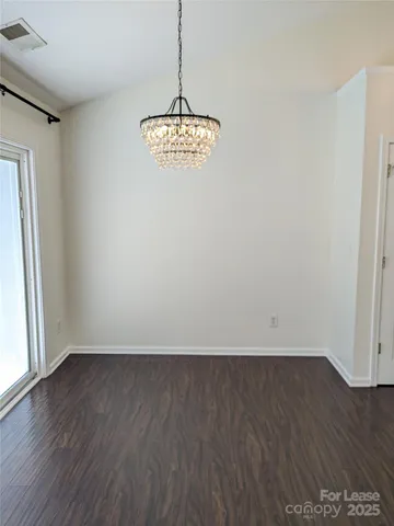 a kitchen with stainless steel appliances granite countertop a stove and a refrigerator