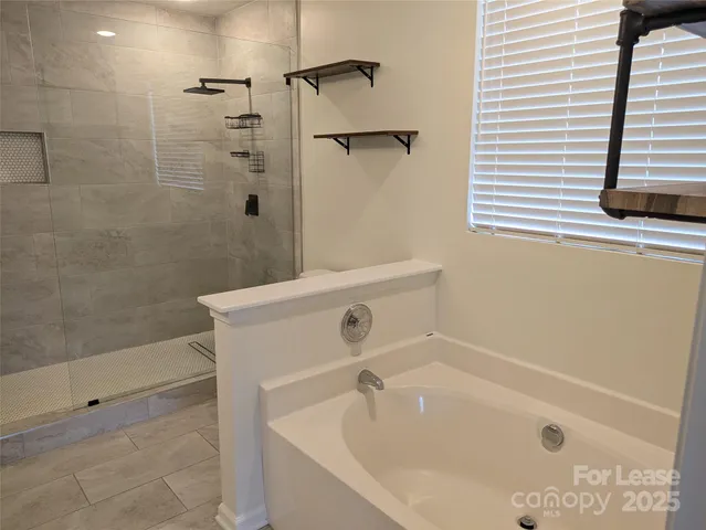 a bathroom with a shower and toilet