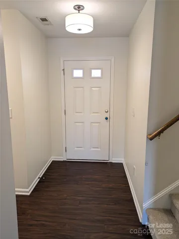 an empty room with wooden floor