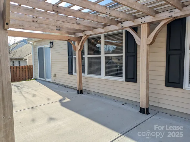 a view of a yard with large trees