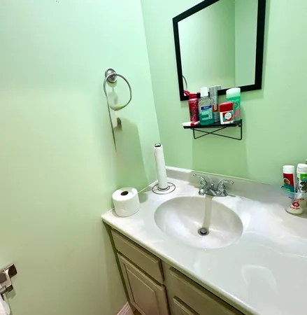 a bathroom with a sink and a mirror