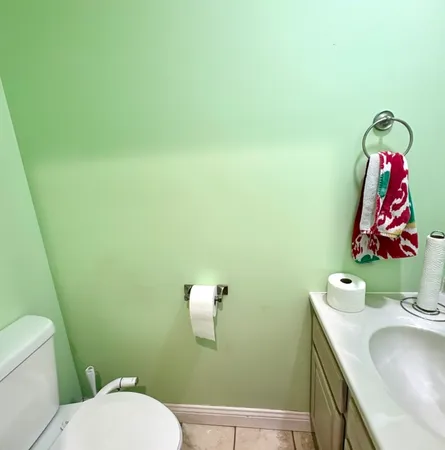a bathroom with a sink toilet and vanity