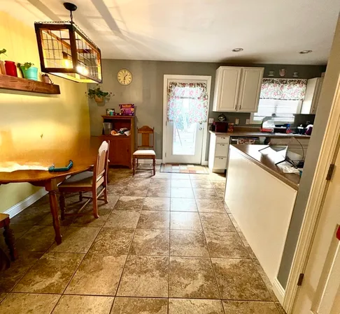 a kitchen with stainless steel appliances a sink stove and cabinets