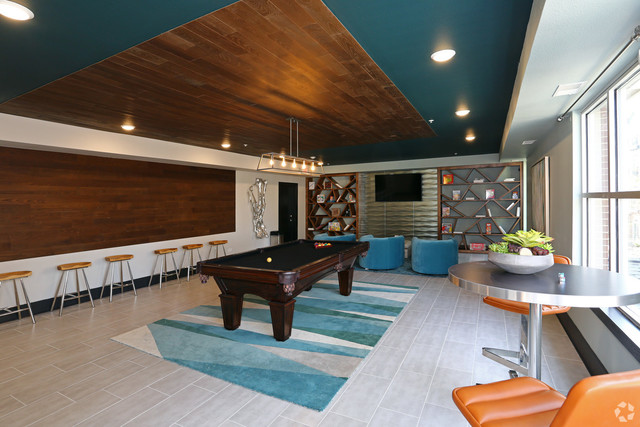 670 East Algonquin Road, Unit 4409 Schaumburg, IL 60173 - Photo 14 of 23 a living room with furniture pool table and a flat screen tv