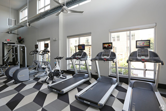 670 East Algonquin Road, Unit 4409 Schaumburg, IL 60173 - Photo 15 of 23 a room with gym equipment and a large window