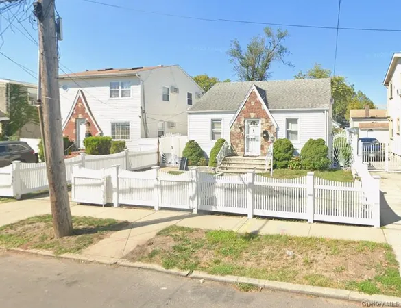 a view of houses with a street