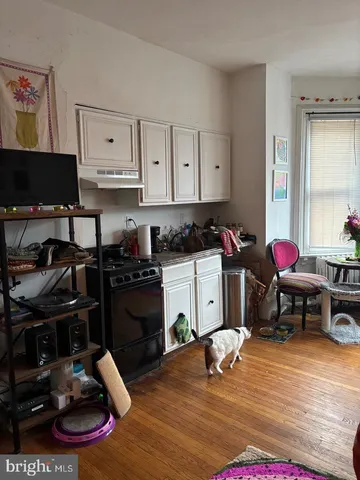 a kitchen with a stove a refrigerator and a stove